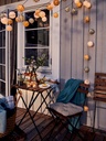 TÄRNÖ Chair, outdoor - foldable black/light brown stained
